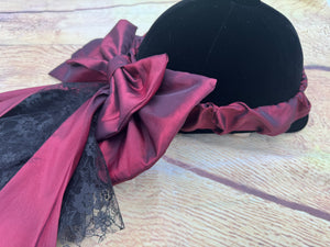 Burgundy taffeta and lace  on an elasticated band.