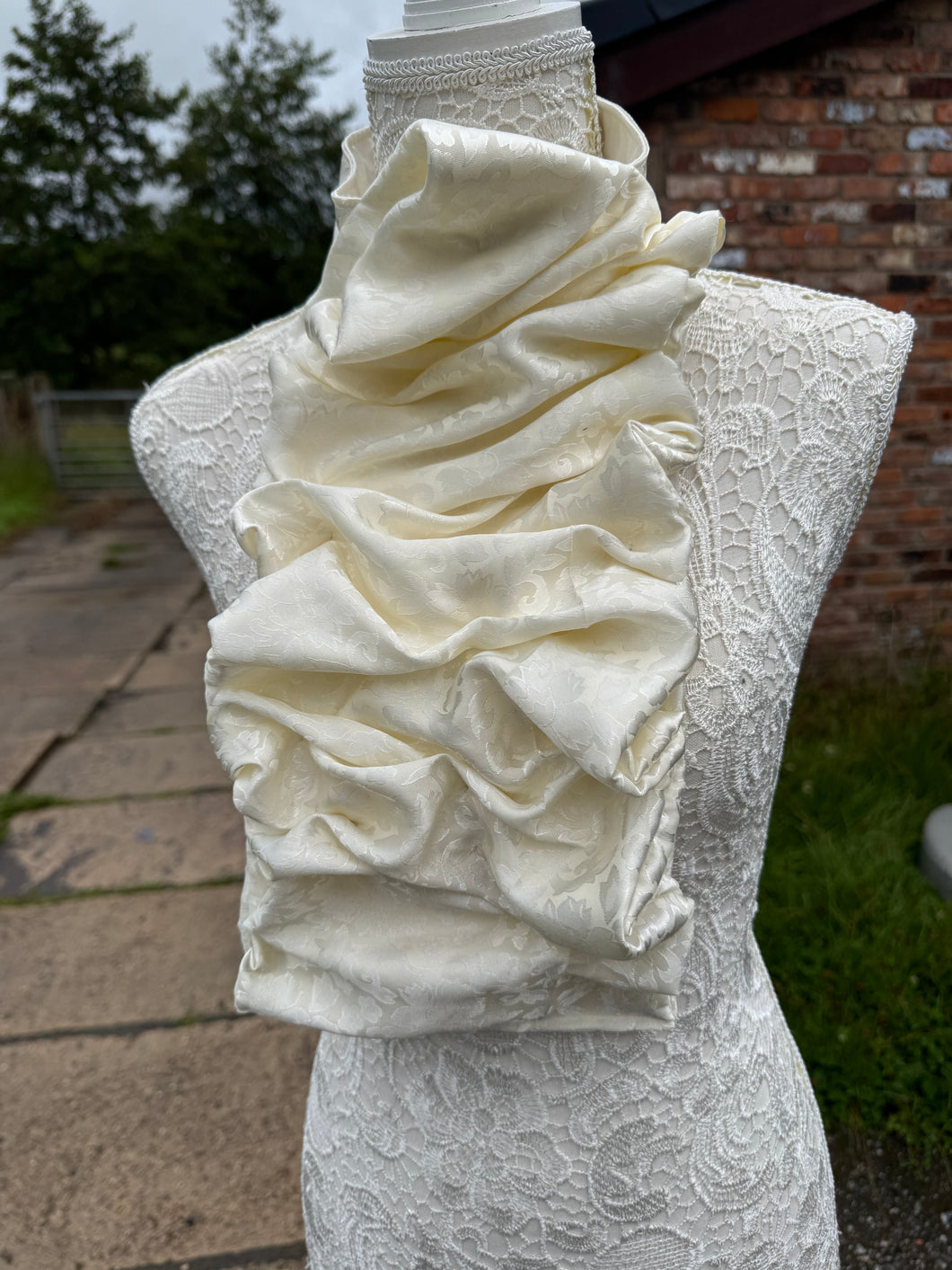 Ivory floral silk satin ruched stock