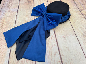 Blue satin bow with beaded lace
