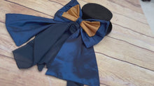 Load and play video in Gallery viewer, Navy blue hat band with gold bow and navy drape

