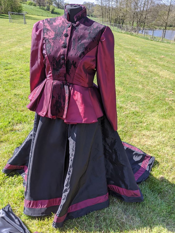 Light burgundy with black skirt concours d'elegance costume