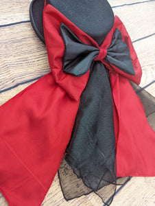 Red and black hat band and bow